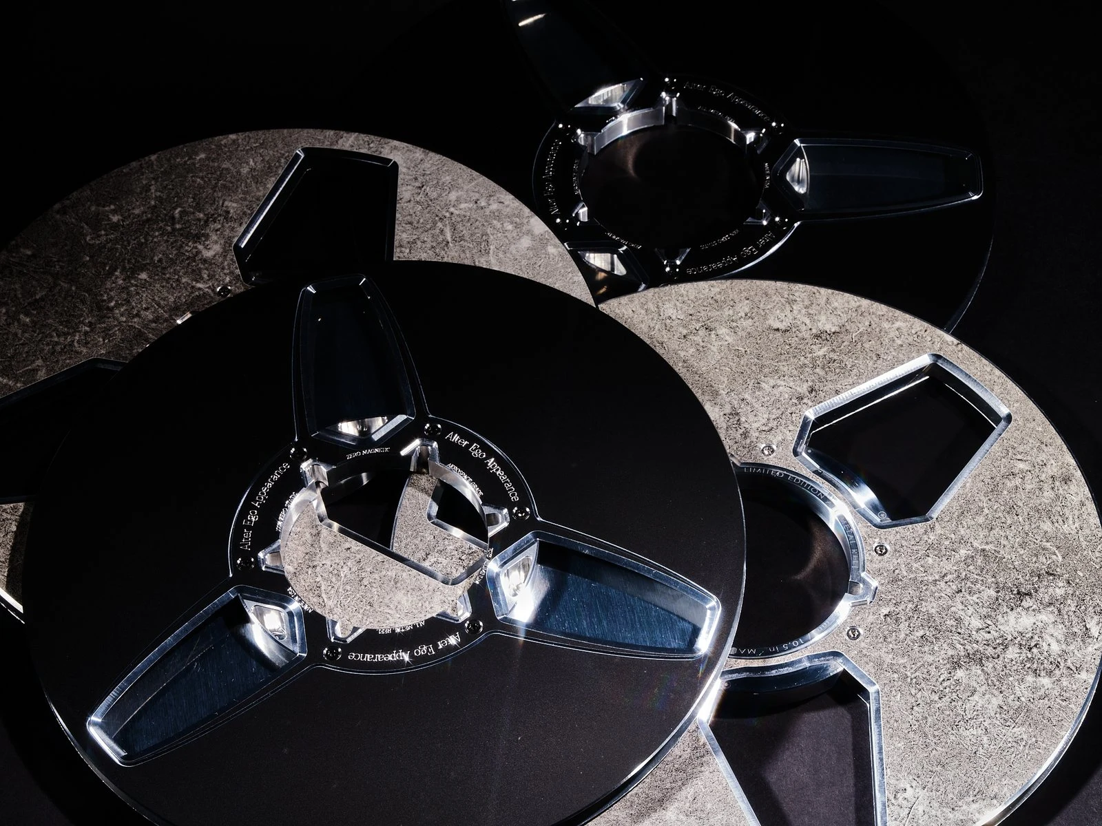 Sculpted Alter Ego Appearance reels with polished spokes and textured metal surfaces